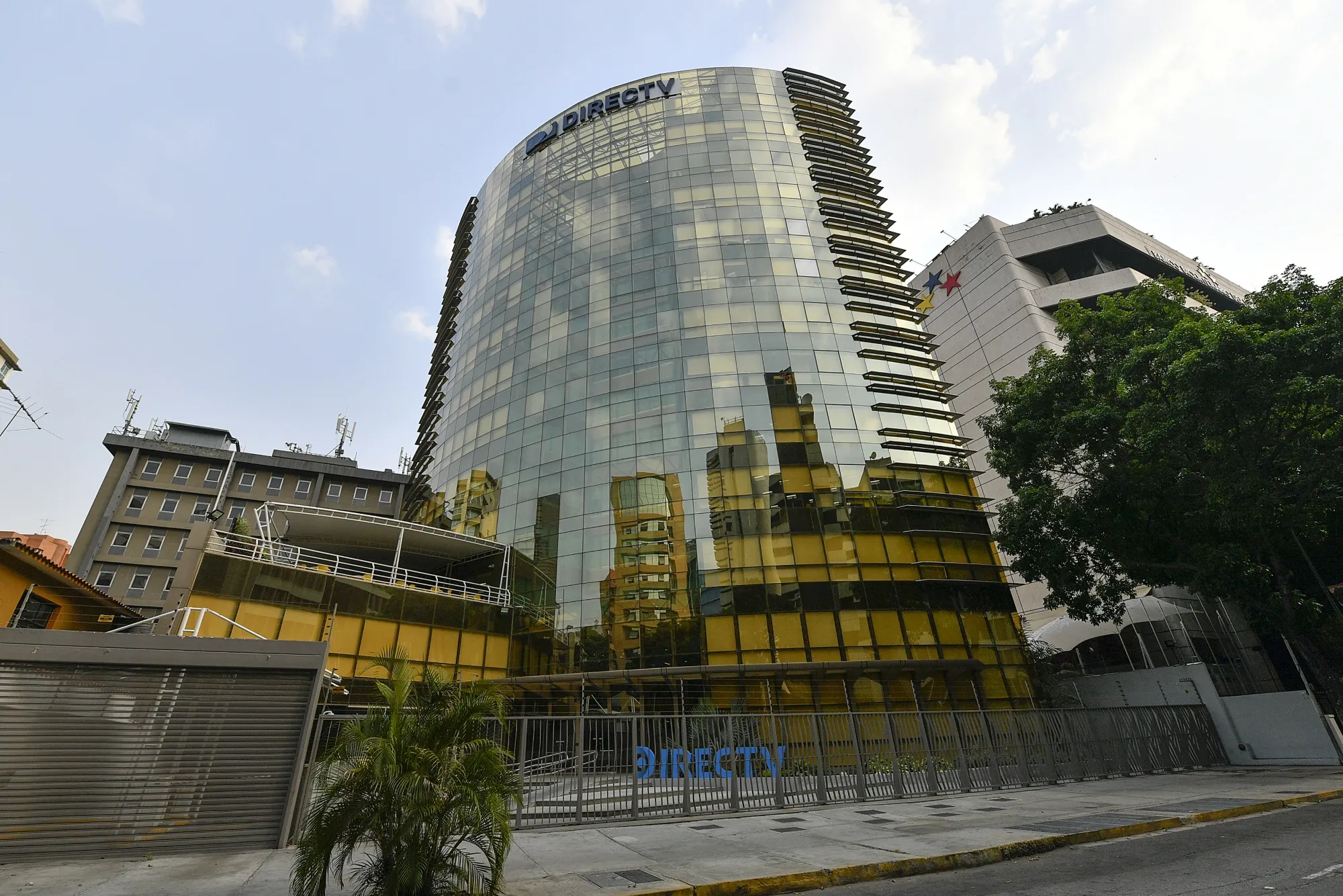 A gate blocks access to the DirectTV building in Caracas, Venezuela, on May 19.