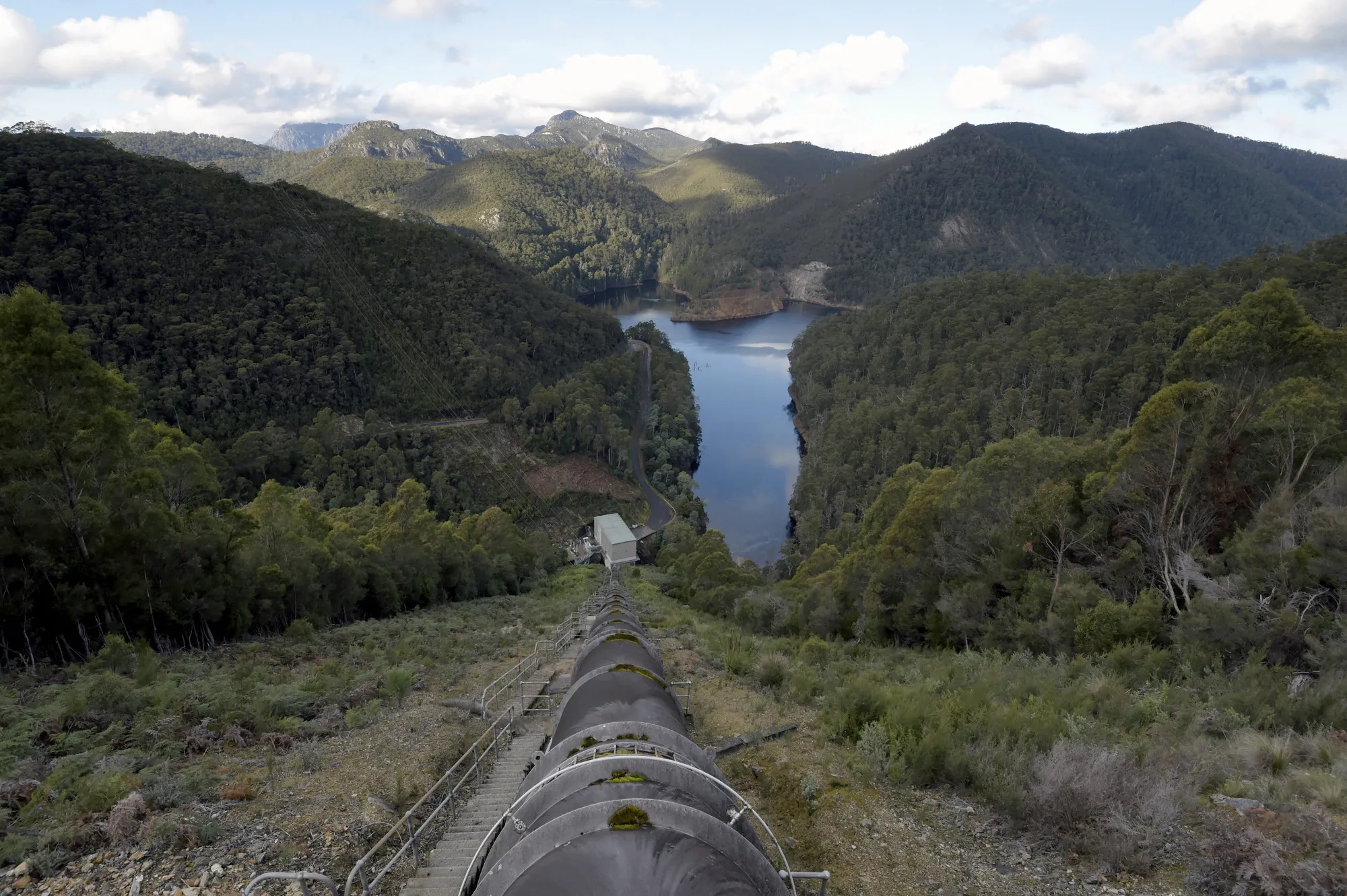 A water pipe runs towards the Wilmot Power Station next to Lake Cathena in Tasmania. Tasmania gets about four-fifths of its power from hydro.