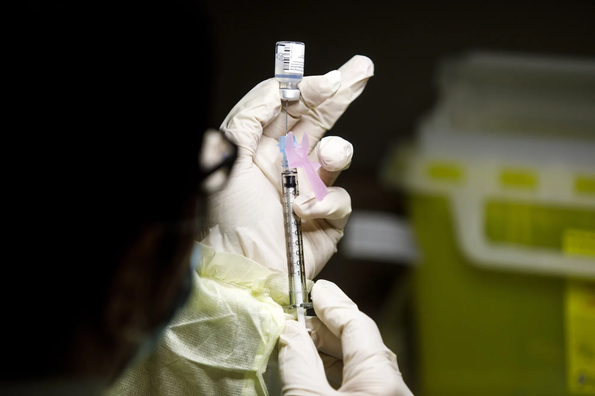 A technician prepares a Pfizer-BioNTech Covid-19 vaccine at a UHN vaccination clinic in Toronto, Ontario, Canada, on Dec. 15.&nbsp;