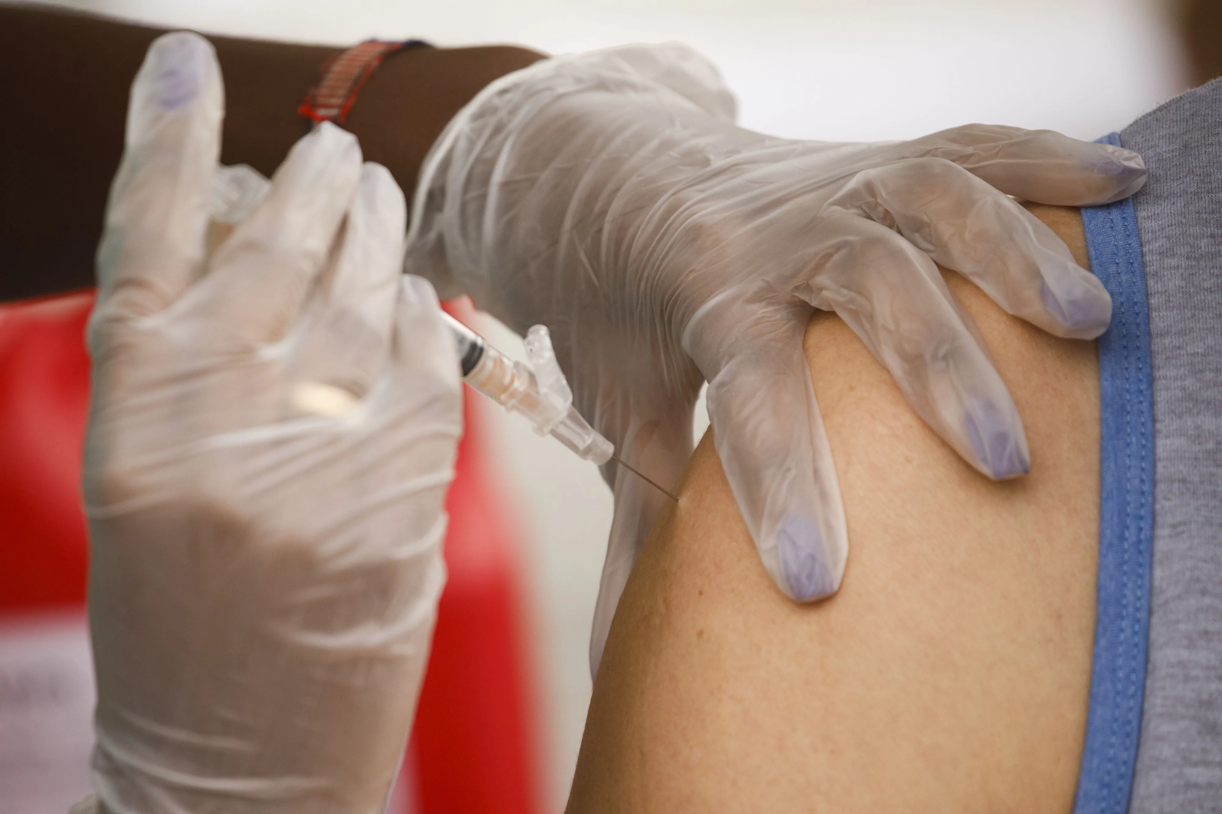 A healthcare worker administers a flu shot&nbsp;in Los Angeles, California, US.