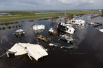 Damaged trailers in floodwater after Hurricane Ida in Pointe-au-Chien, Louisiana, Sept. 2, 2021. 