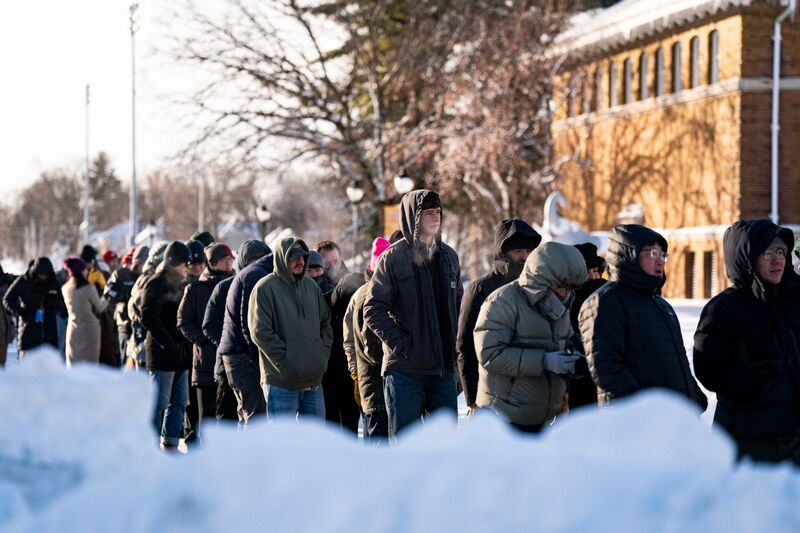 Attendees wait in line outside prior to a campaign event with Donald Trump at Simpson College in Indianola, Iowa, on Jan. 14.