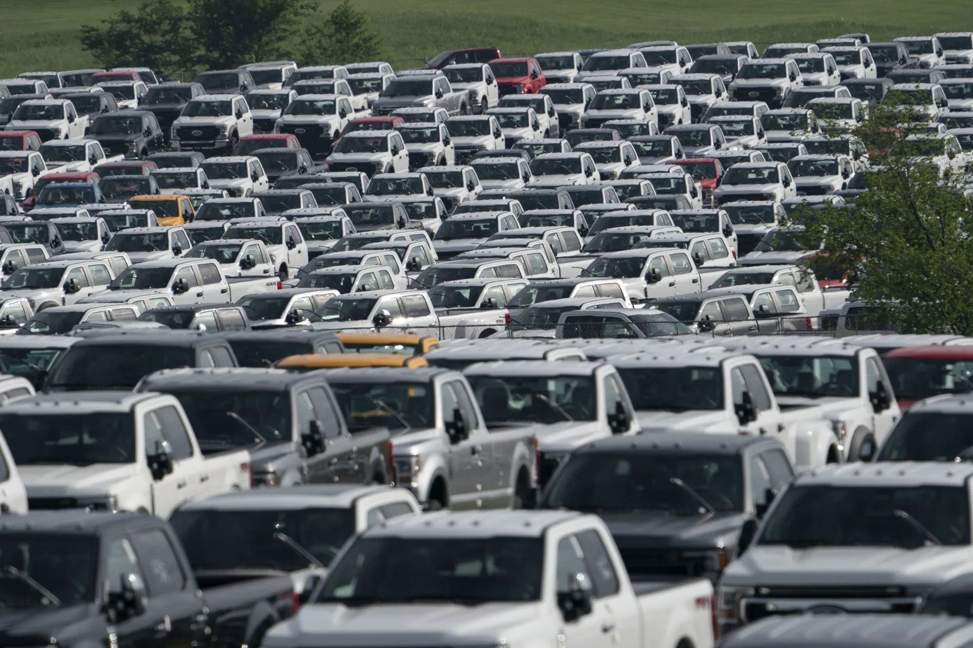 New Ford F-Series pickup trucks stored in a lot during a semiconductor shortage at Kentucky Speedway in Sparta, Kentucky.