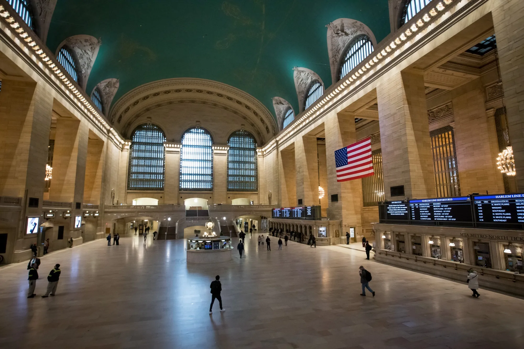 Pedestrians walk through Grand Central Terminal in New York on March 19.