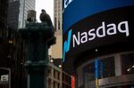 A monitor displays signage in front of the Nasdaq MarketSite in the Times Square area of New York, U.S.