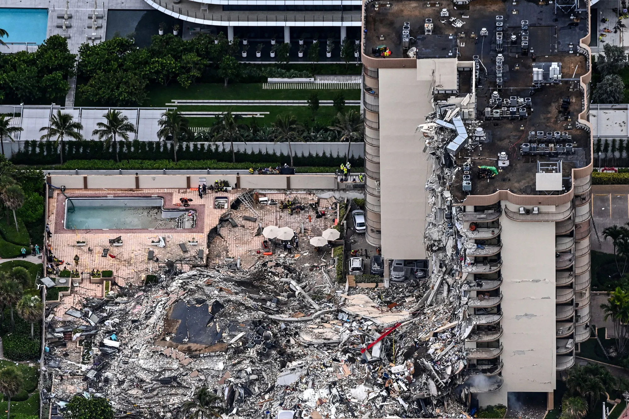 Aerial view shows search and rescue personnel working on site of the partial collapse of the Champlain Towers South in Surfside, north of Miami Beach, on June 24, 2021.