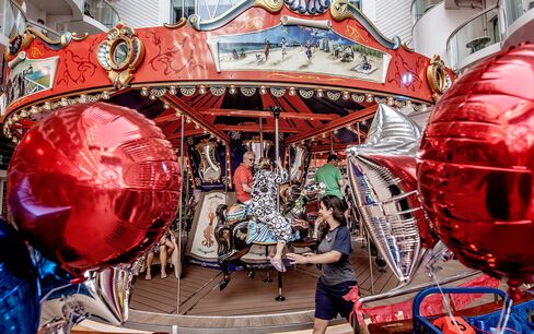 Guests enjoy the carousel in the amusement park-style Boardwalk neighborhood.