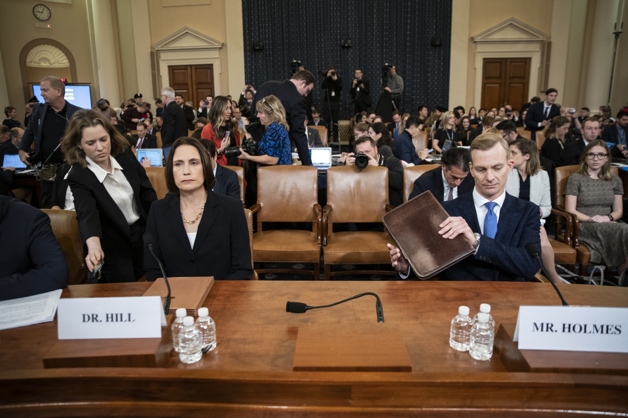 Fiona Hill and David Holmes arrive to a House Intelligence Committee impeachment inquiry hearing in Washington, D.C. on Nov. 21.