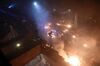 Anti-government protesters start a large fire in a staircase at the main entrance that leads into the Hong Kong Polytechnic University in the Hung Hom district of Hong Kong on November 18, 2019. 