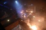 Anti-government protesters start a large fire in a staircase at the main entrance that leads into the Hong Kong Polytechnic University in the Hung Hom district of Hong Kong on November 18, 2019.