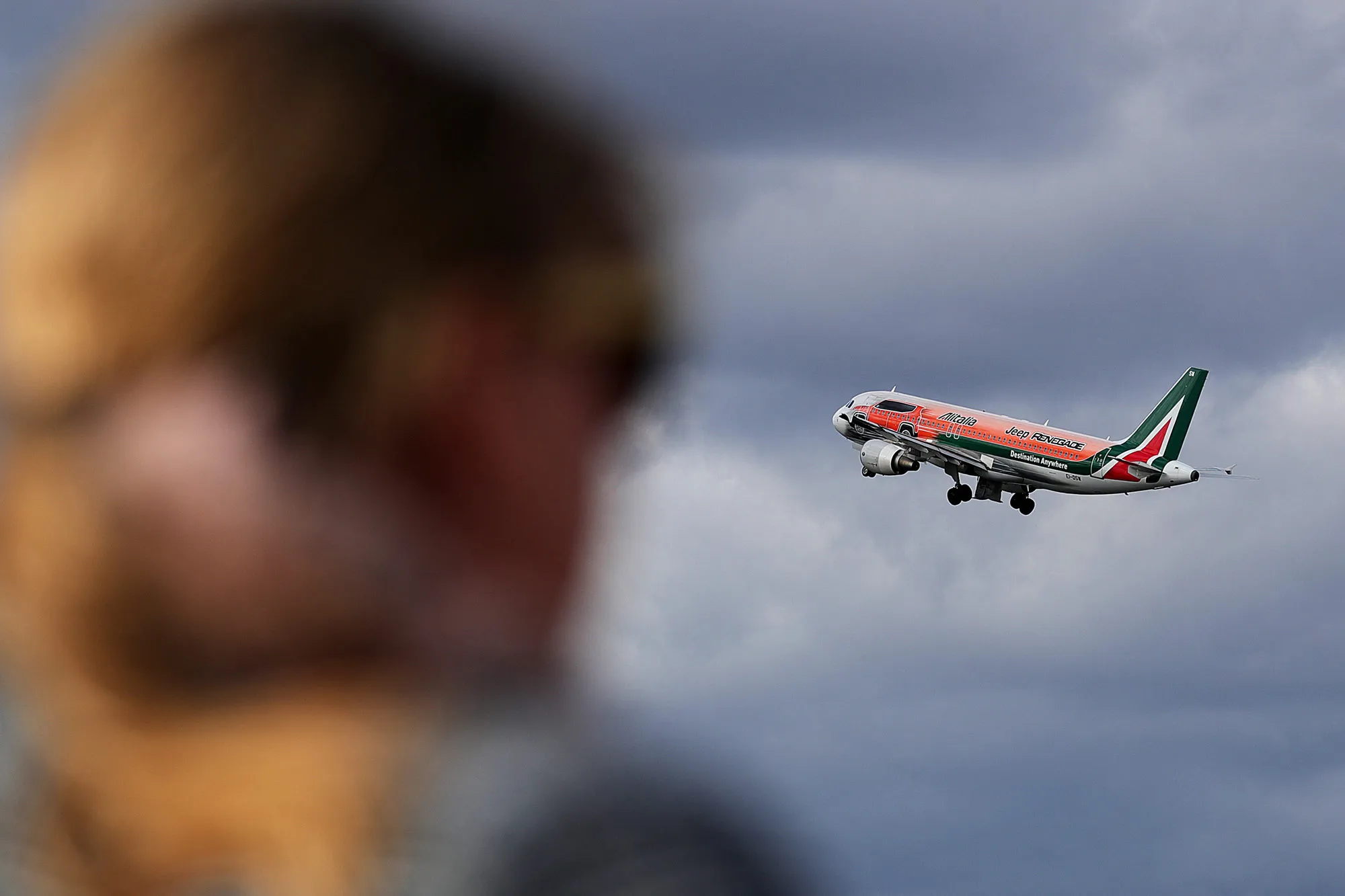 An Airbus A320 aircraft, operated by Alitalia S.p.A., flies from Tegel airport in Berlin.