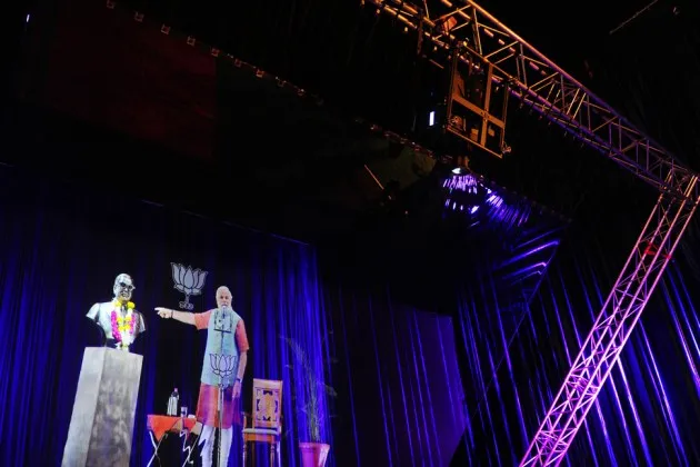 BJP prime ministerial candidate Narendra Modi is pictured during a live '3D hologram' telecast in Allahabad on April 14, 2014