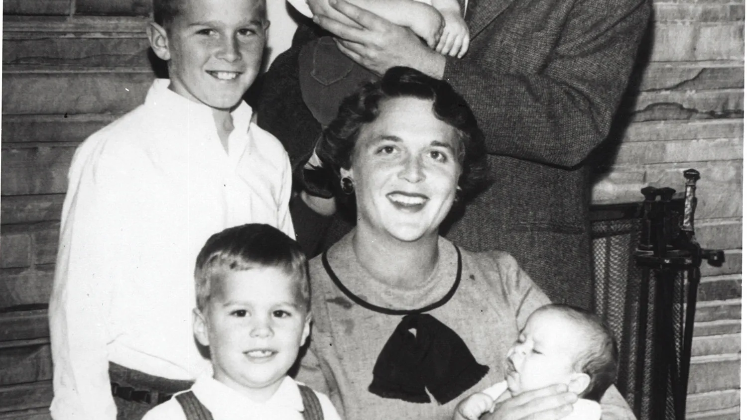 Barbara Bush and George Bush pose with children Neil Bush, George W. Bush, Jeb Bush and Marvin Bush in 1956.
