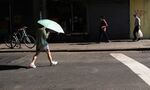 Pedestrians walk through Manhattan on Aug. 4.