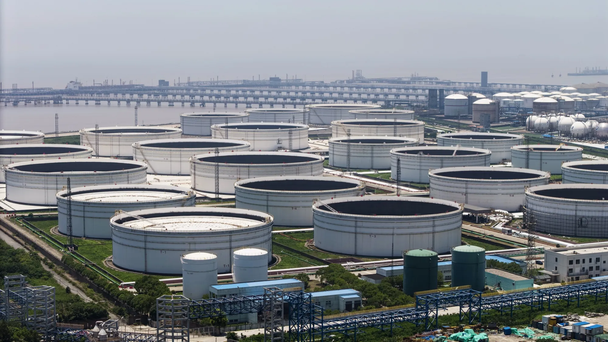 Oil storage tanks at a petrochemical production base on the outskirts of Shanghai, China.