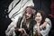 A visitor poses with an actor dressed as Captain Jack Sparrow from "Pirates of the Caribbean" at Walt Disney Co.'s Shanghai Disneyland theme park during a trial run ahead of its official opening, in Shanghai, China, on Wednesday, June 8, 2016. With the new $5.5 billion resort opening on June 16, Disney will have six resorts globally, capitalizing on the company's six decades of running theme parks. Photographer: Qilai Shen/Bloomberg