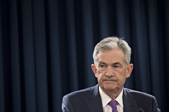 Powell Says Solid Economy Faces Headwinds as Fed Mulls Rates