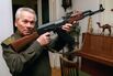 Mikhail Kalashnikov with a model of his world-famous AK-47 assault rifle in 1997.