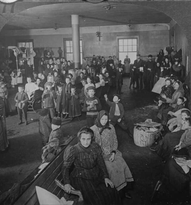 Newly arrived immigrants awaiting examination at New York City’s Ellis Island in 1905.