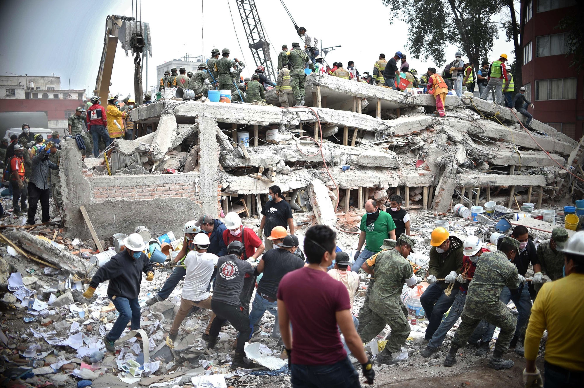 Rescuers search for survivors in a flattened building in Mexico City following the earthquake in 2017.