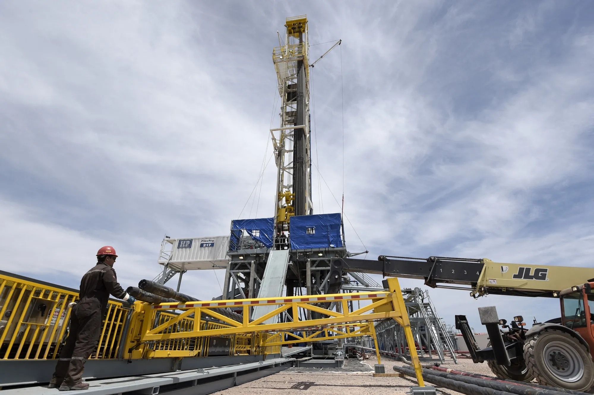 A technician prepares an oil drilling rig&nbsp;on the Vaca Muerta Shale oil reservoir in Loma Campana, Argentina.