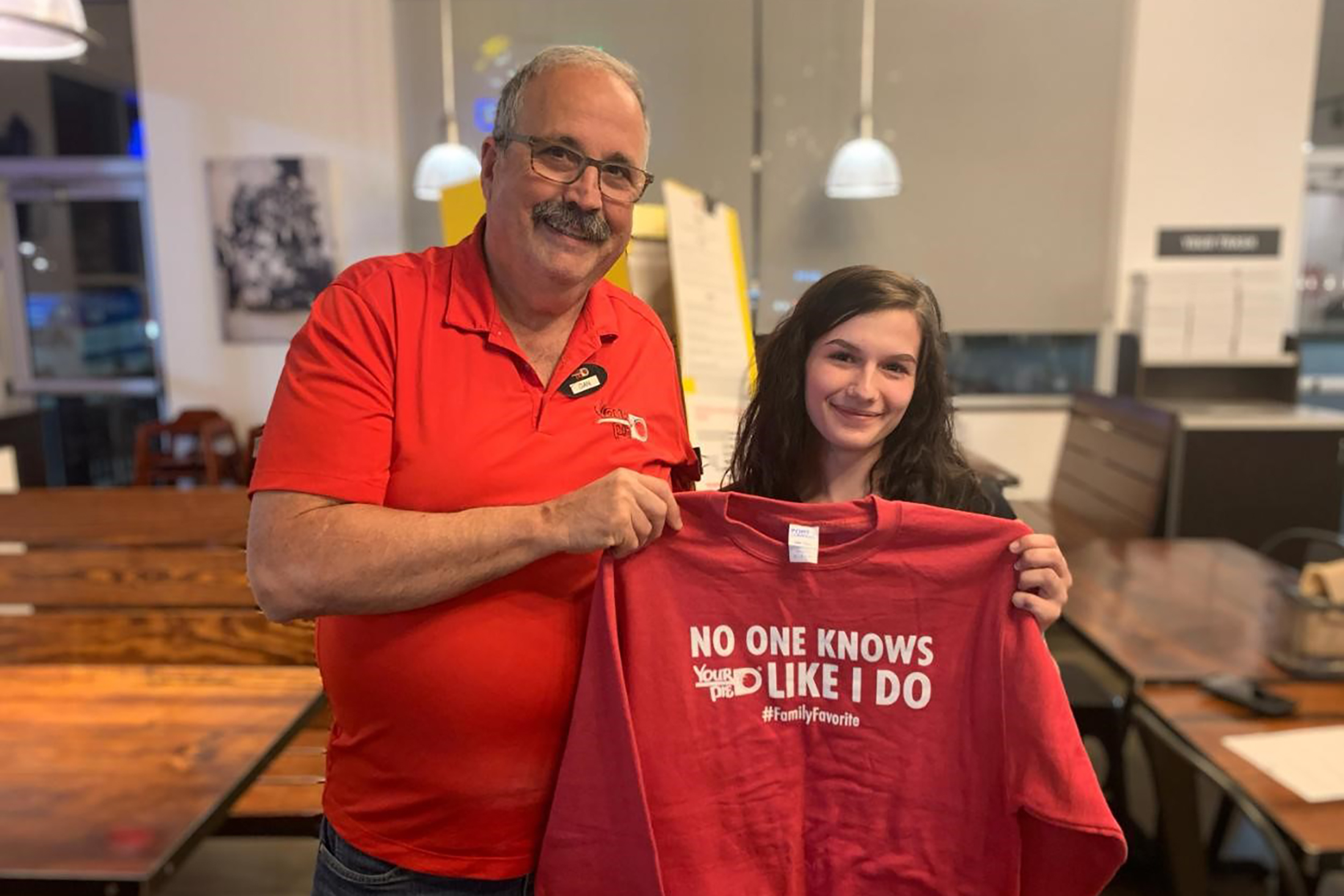 Dan Sacco with one his employees at a Your Pie pizzeria location in Iowa.