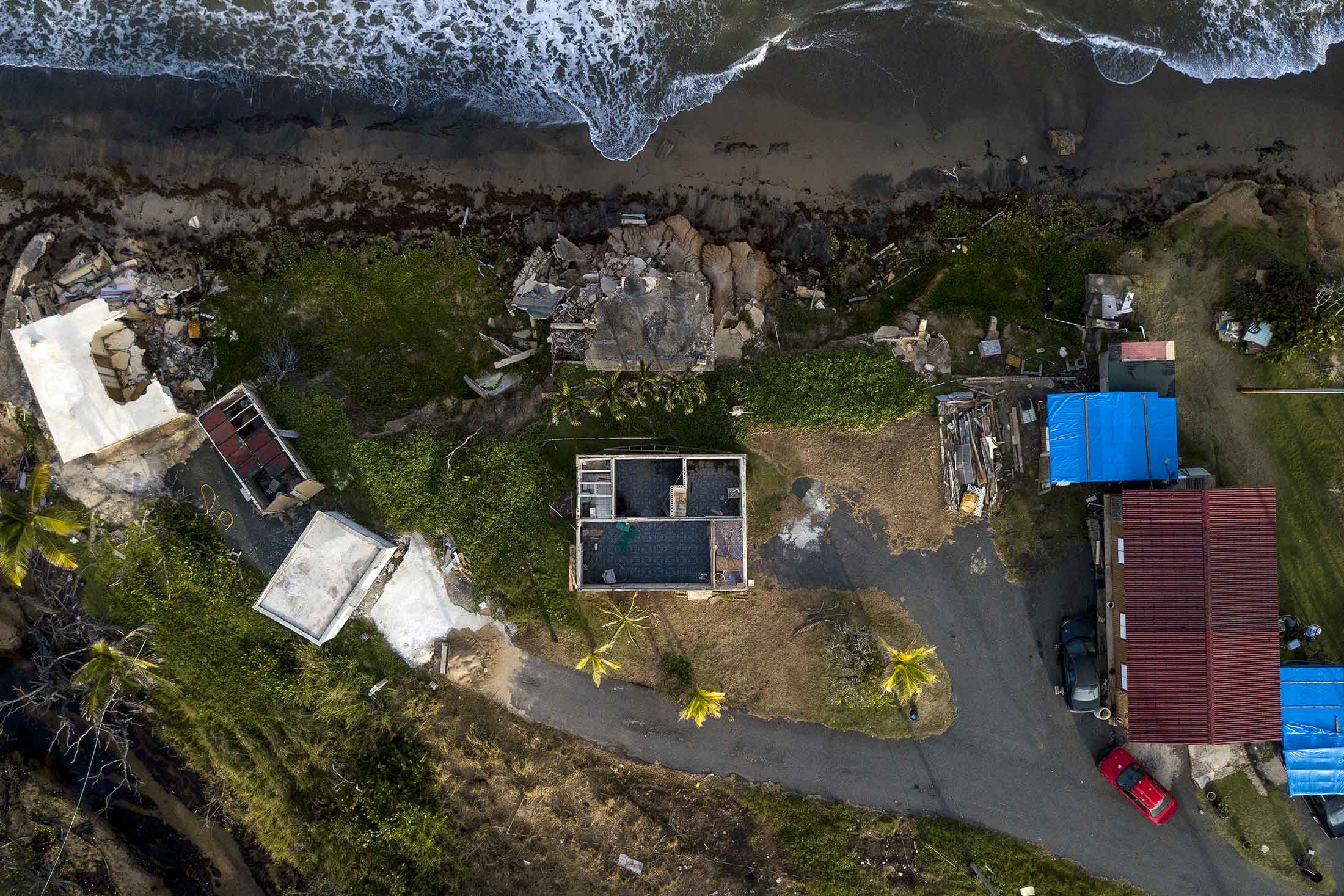 Homes damaged by Hurricane Maria are seen in an aerial photograph taken over El Negro, Yabucoa, Puerto Rico, on Sept. 17, 2018.