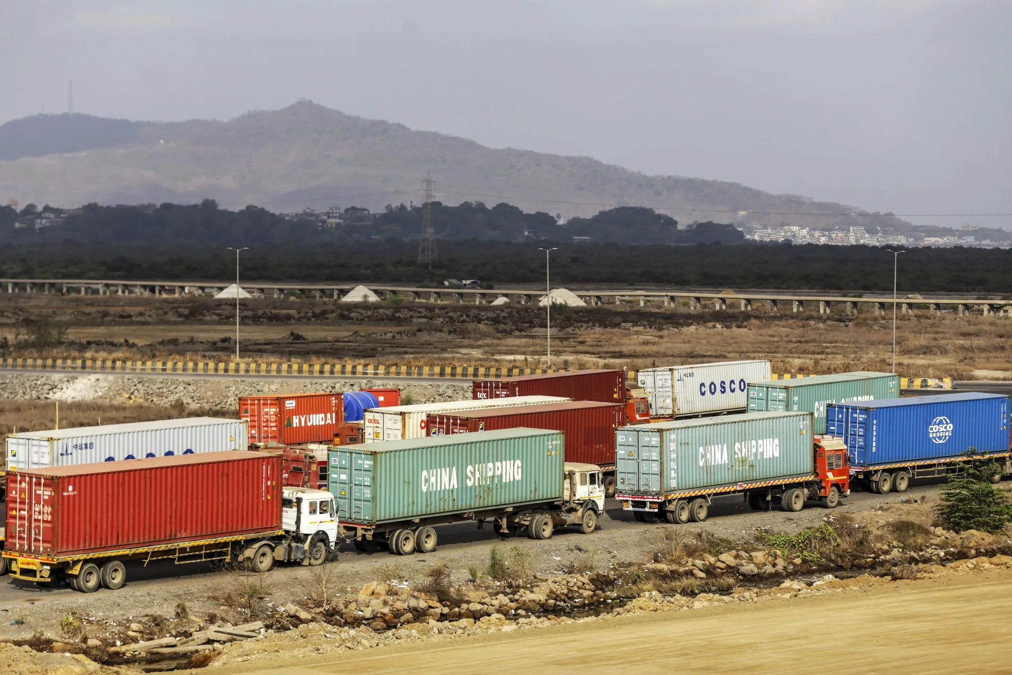 Container trucks near the Jawaharlal Nehru Port, in Navi Mumbai, Maharashtra, India.