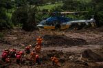 Rescue workers attempt to remove a body after a Vale dam burst in Brumadinho, Brazil, on Jan. 28.