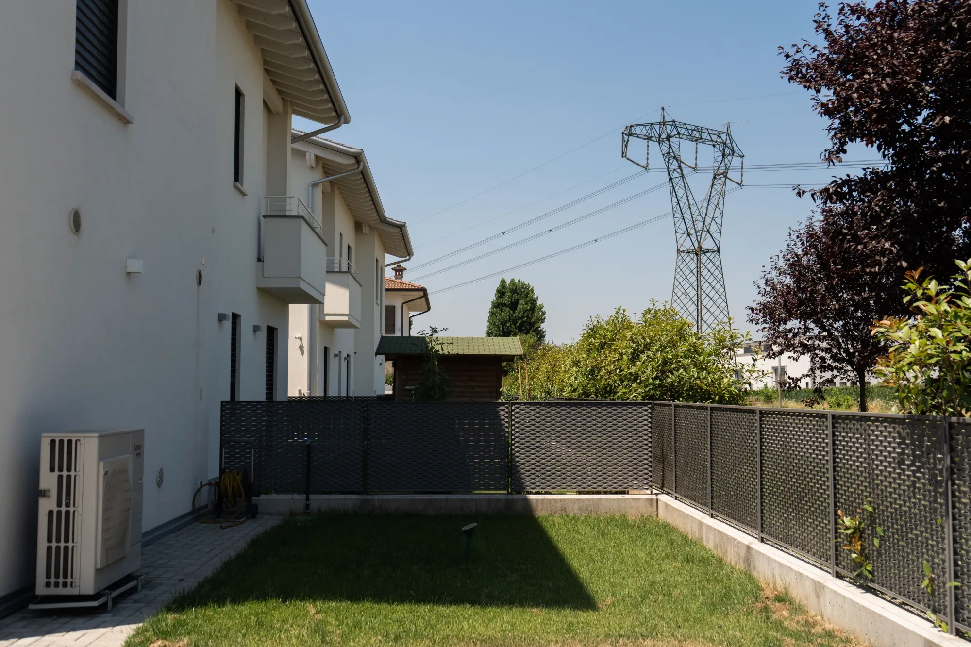 Power lines near a residential area in Brescia, Italy.