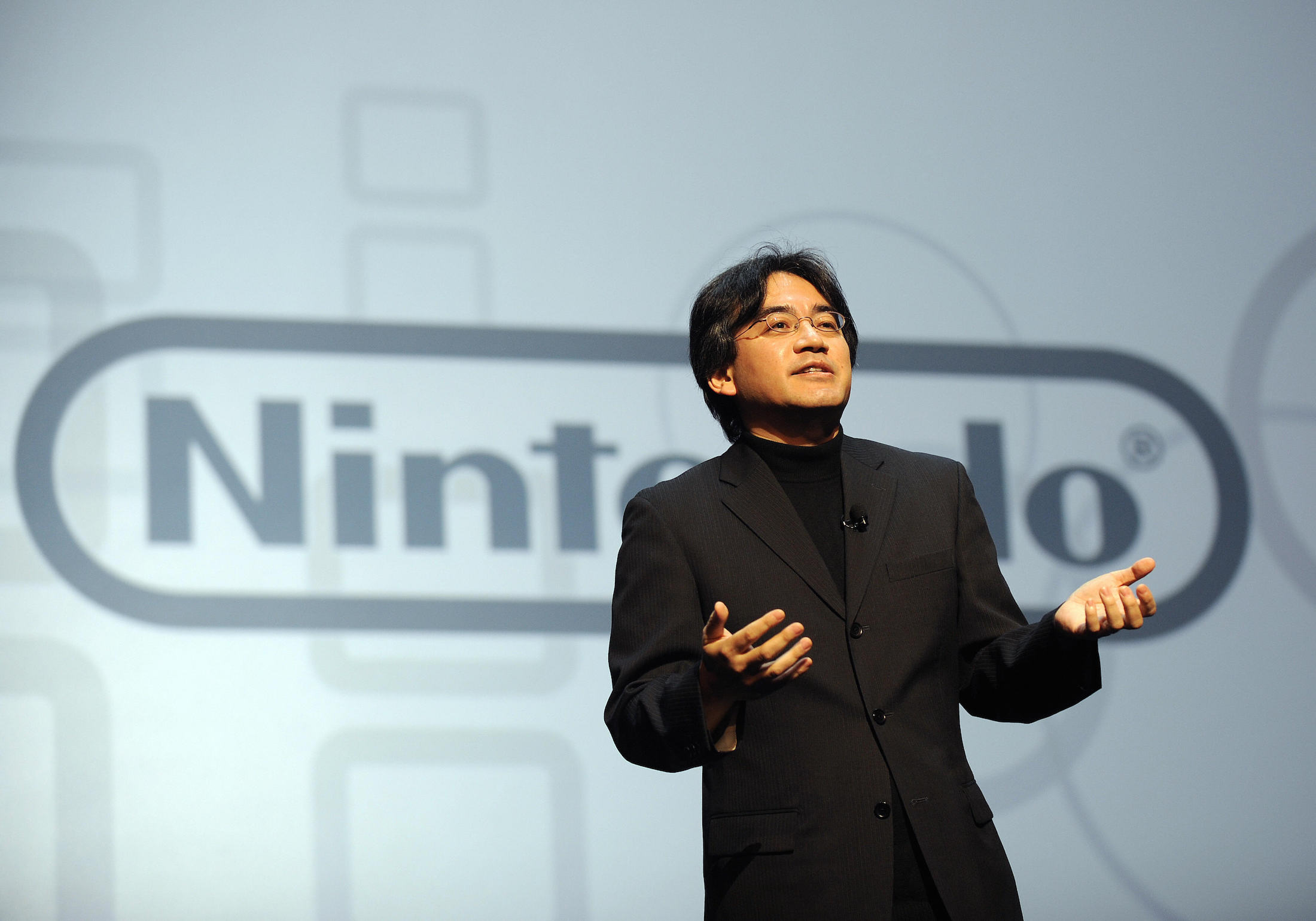 Nintendo President Satoru Iwata speaks as he unveils a Nintendo