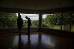 A real estate agent shows a prospective home buyer a house for sale in Peoria, Illinois, U.S..