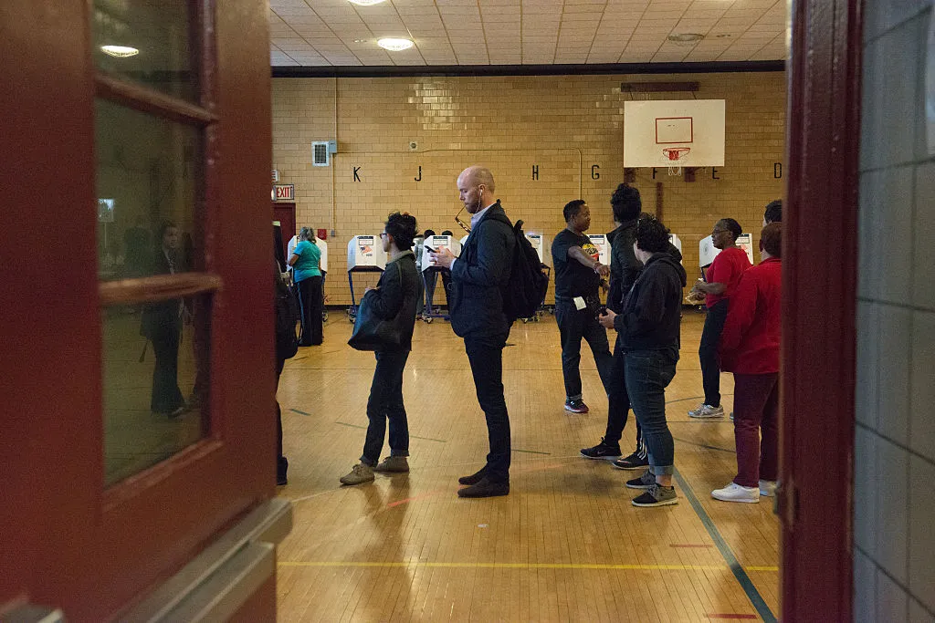 Sure, look at your phone while you wait to vote. Just don’t vote with it.