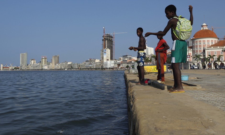 Angolans youths fish against the backdrop of the capital, Luanda. The Local Climate Solutions for Africa 2017 Congress will address water and climate resilience in rapidly urbanizing African cities.