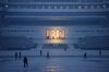 This photo taken on December 3, 2018 shows pedestrians walking past the portraits of late North Korean leaders Kim Il Sung and Kim Jong Il across Kim Il Sung square in Pyongyang.