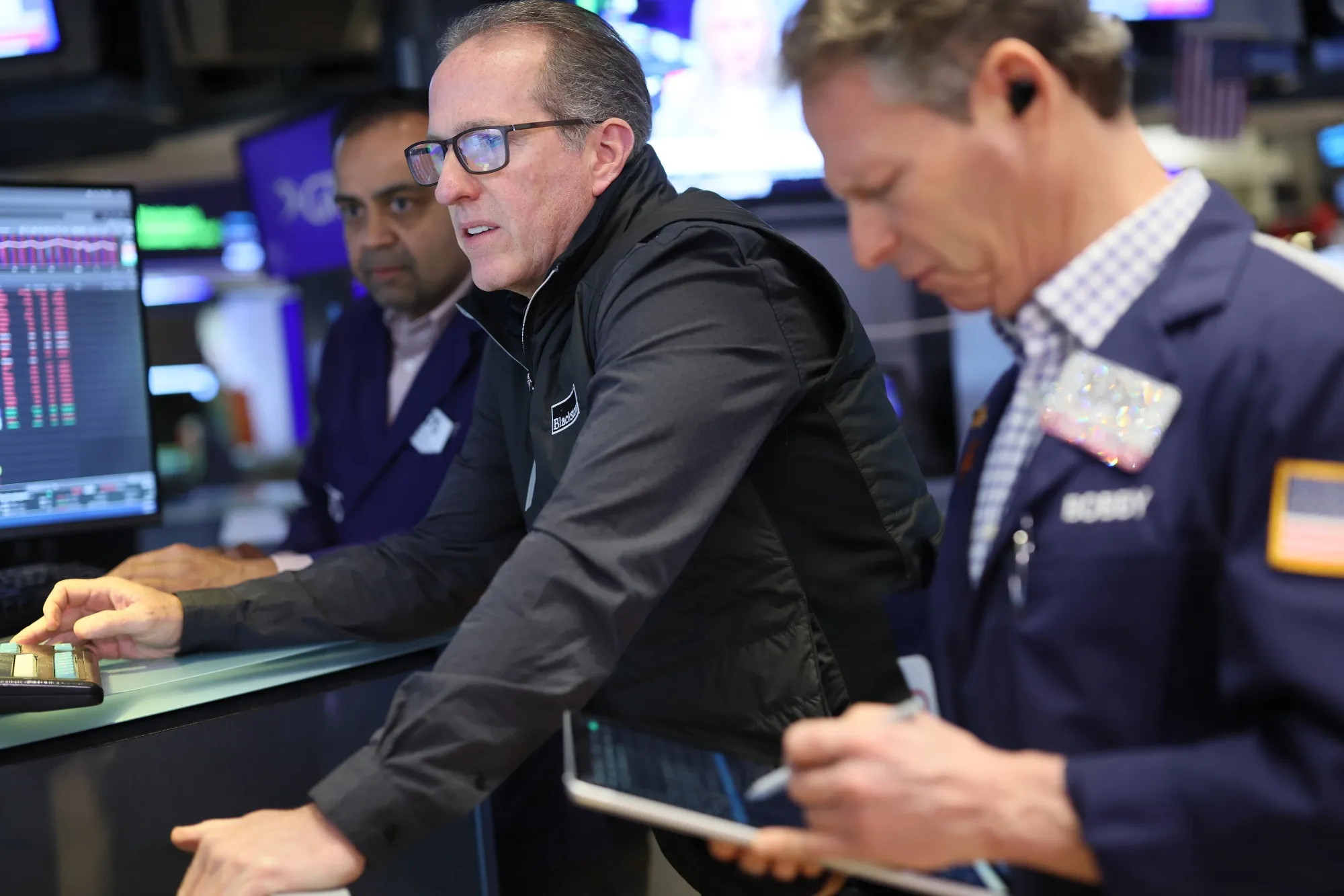Traders work on the floor of the New York Stock Exchange during morning trading in New York on March 6.