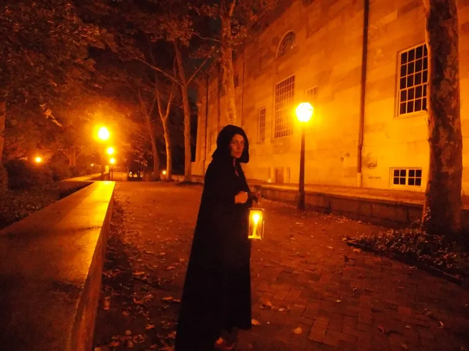 A guide leads her tour out of Signers Garden in Old City.