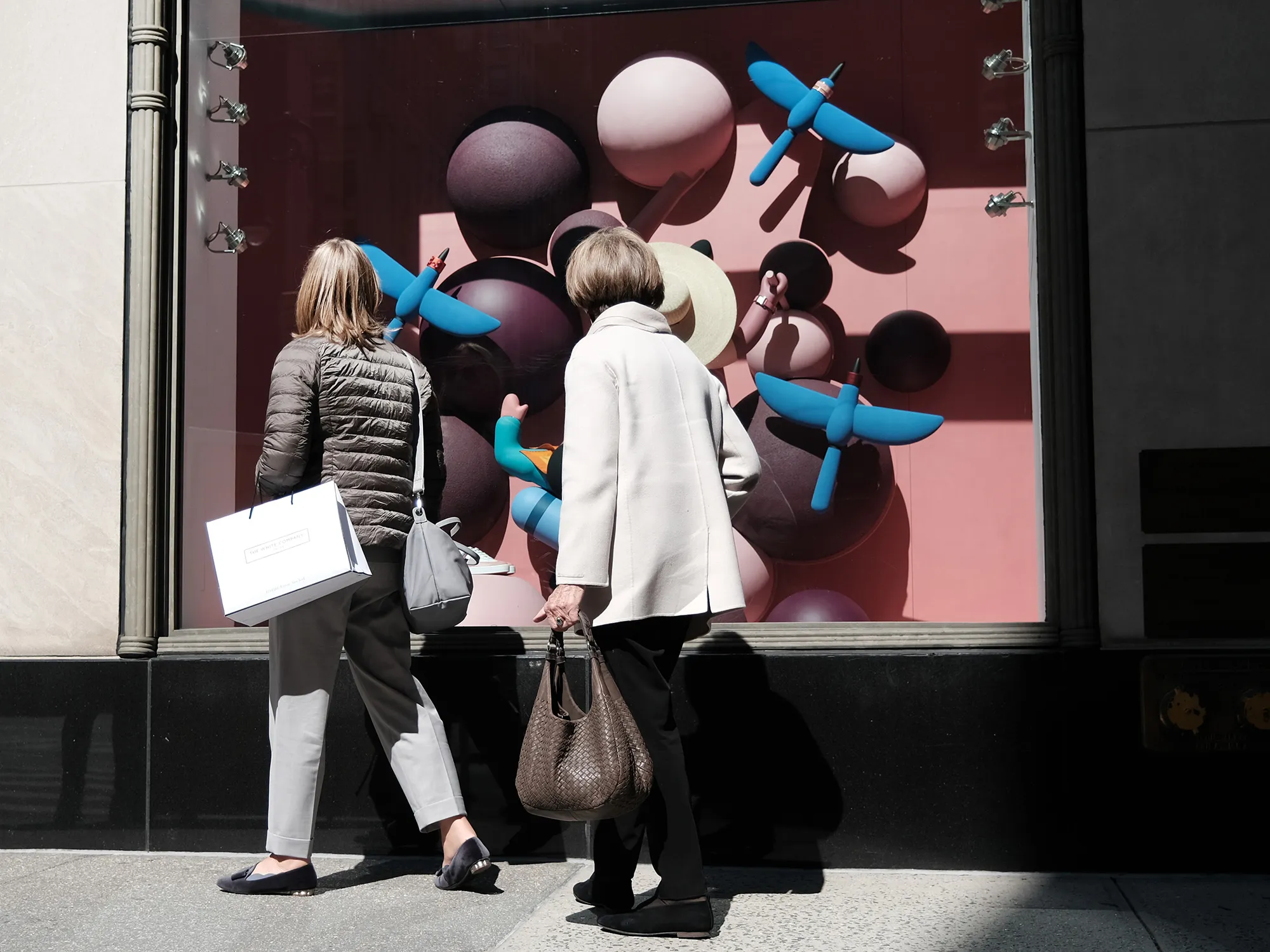 People walk by a department store&nbsp;in New York on April 6.&nbsp;