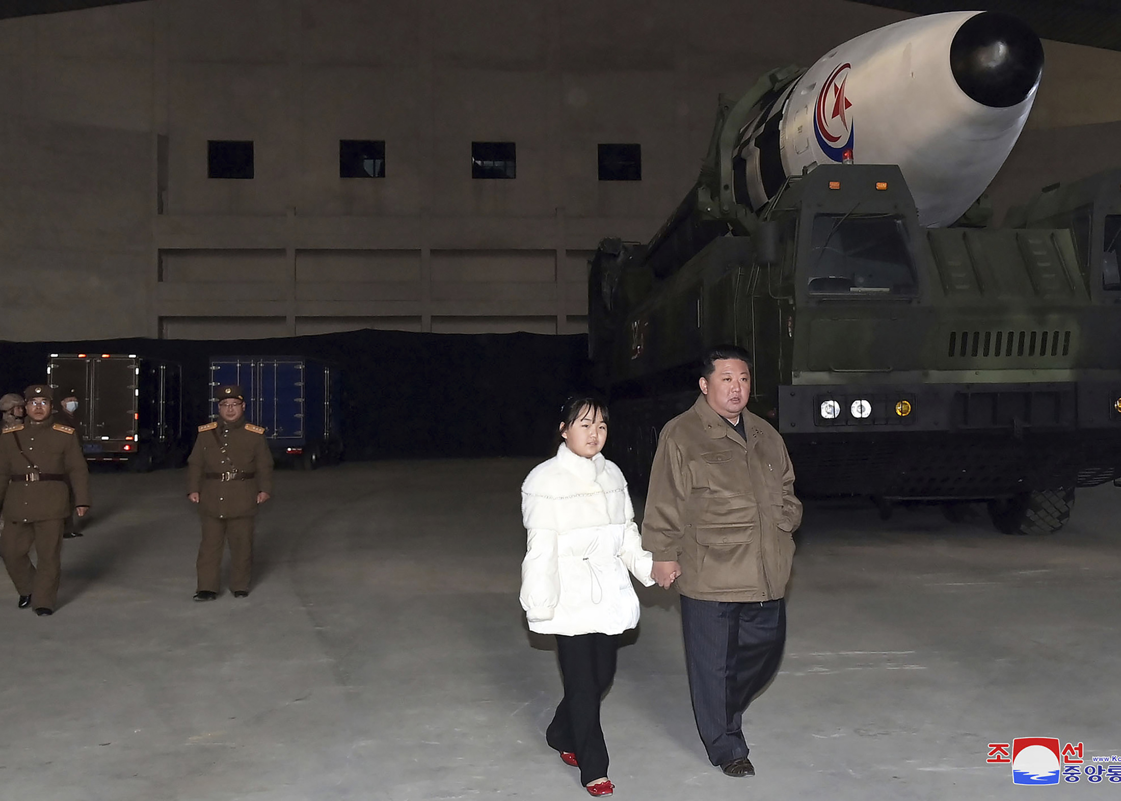Kim Jong Un, right, and his daughter inspects a missile at Pyongyang International Airport in Pyongyang, North Korea, on Nov. 18.