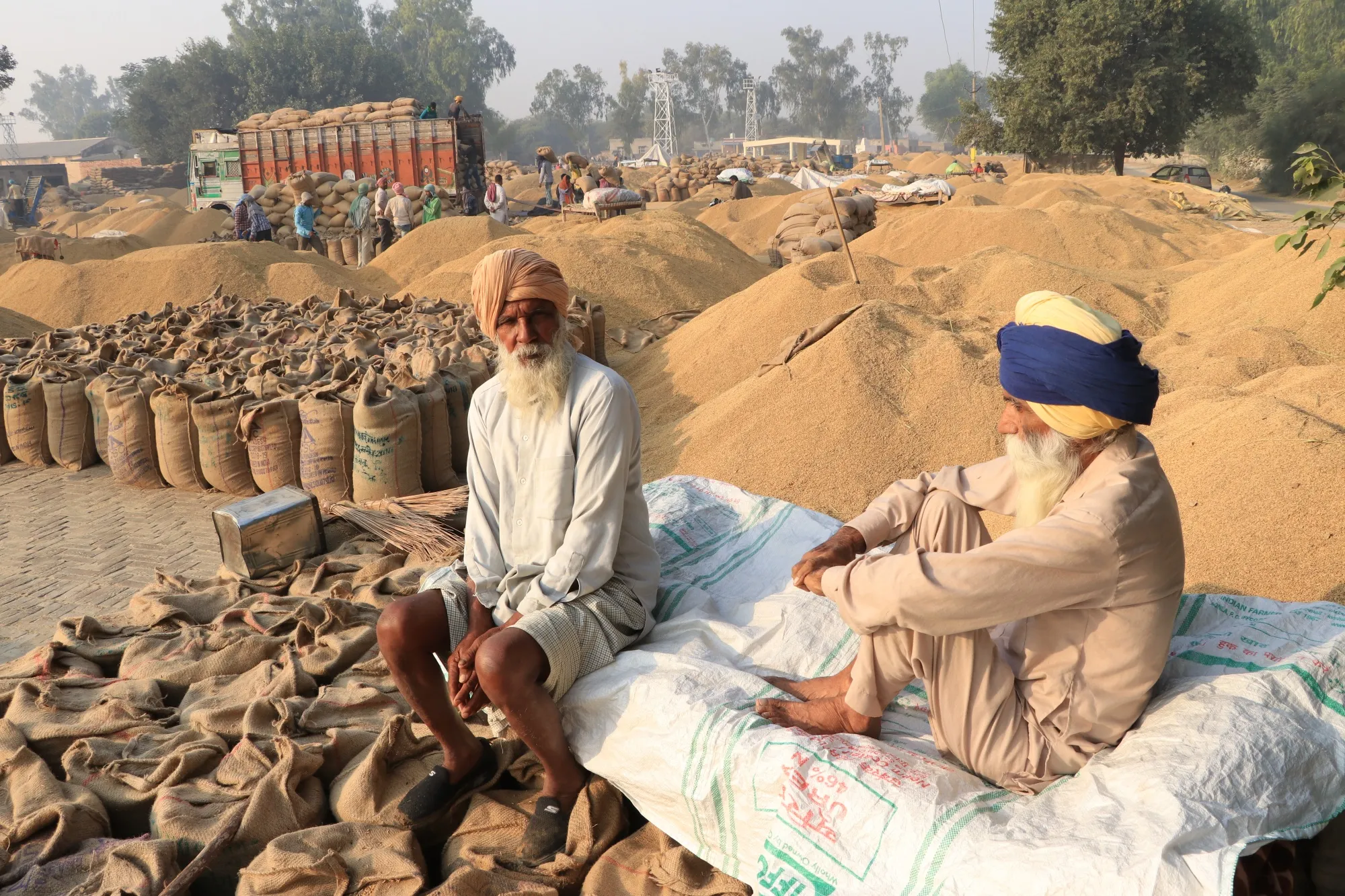 Farmers at the grain market in Multaniya village. Rural incomes have stayed strong as production of monsoon-sown food grains is estimated to hit record.