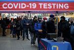 People wait in line to receive a Covid-19 test on January 4, 2022, in New York.