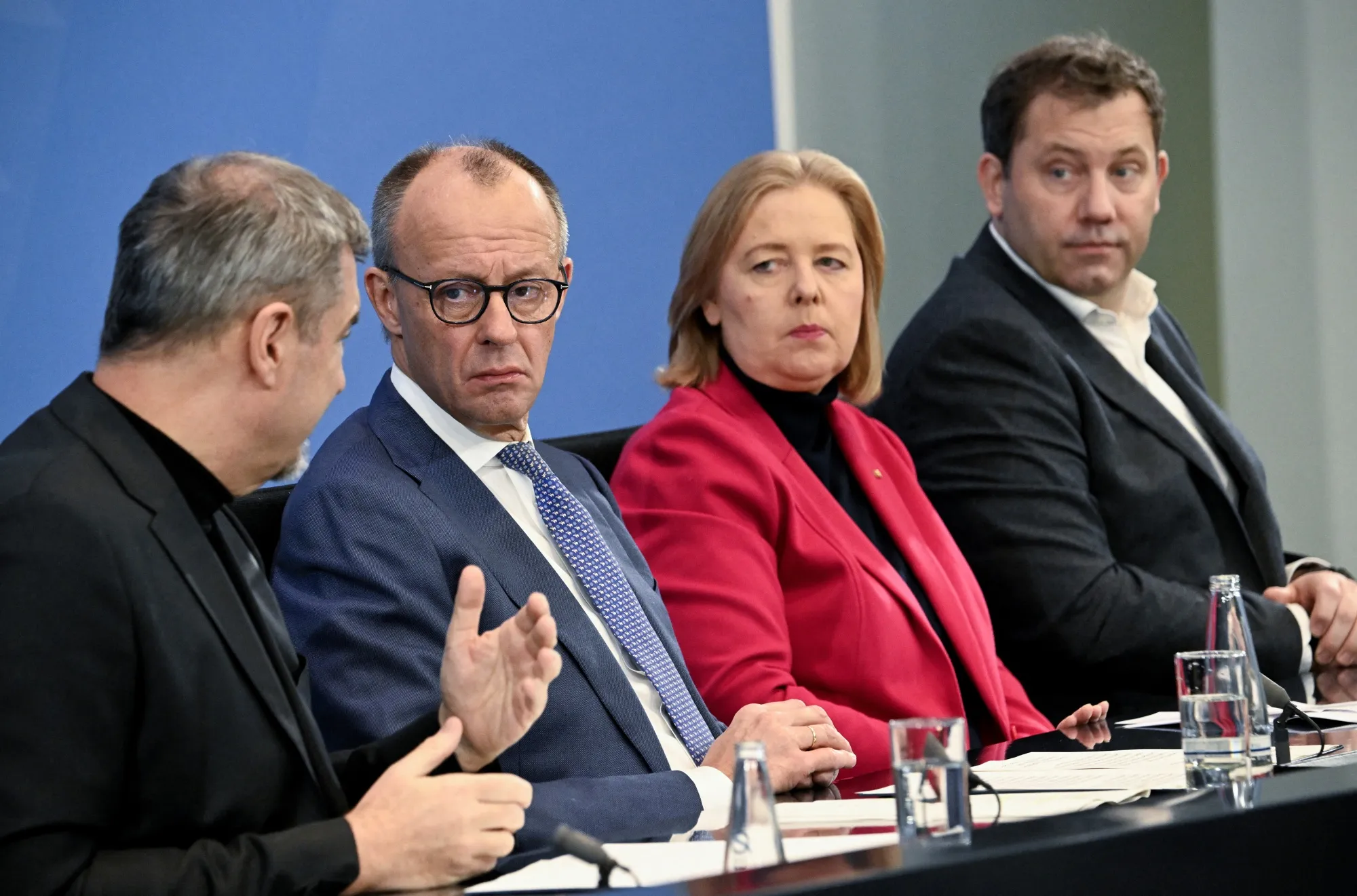 Markus Soeder, Friedrich Merz and SPD co-leaders Baerbel Bas and Lars Klingbeil, from left, in Berlin, on Dec. 11.