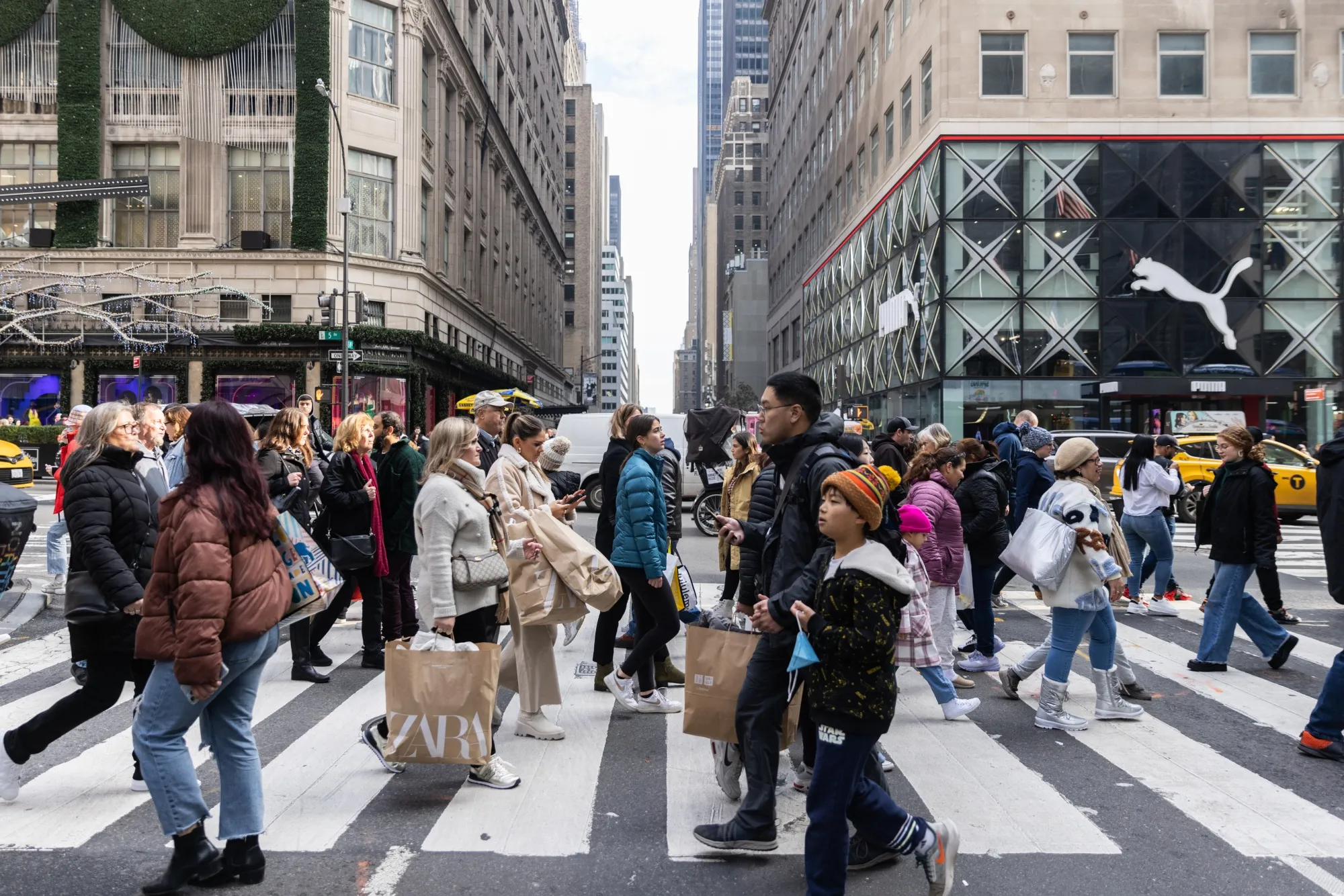 Shoppers walk along 5th Avenue in New York.