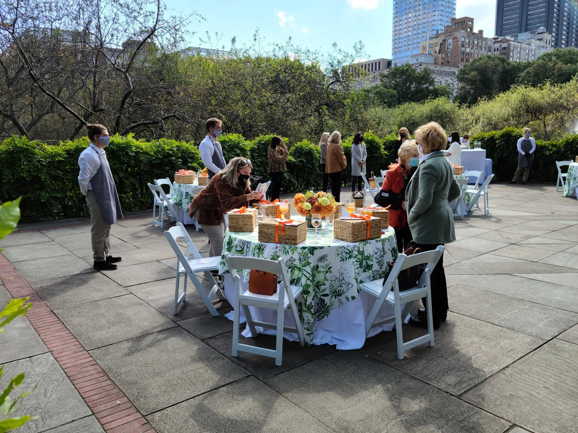 Assembling for a picnic to benefit Central Park. Tables sold for $5,000.