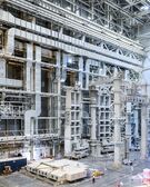 An 800-metric-ton tool will preassemble some of ITER’s largest components before a crane lifts them into the machine well. The tool’s three columns are arranged in a triangle, shown on the right side of the image.