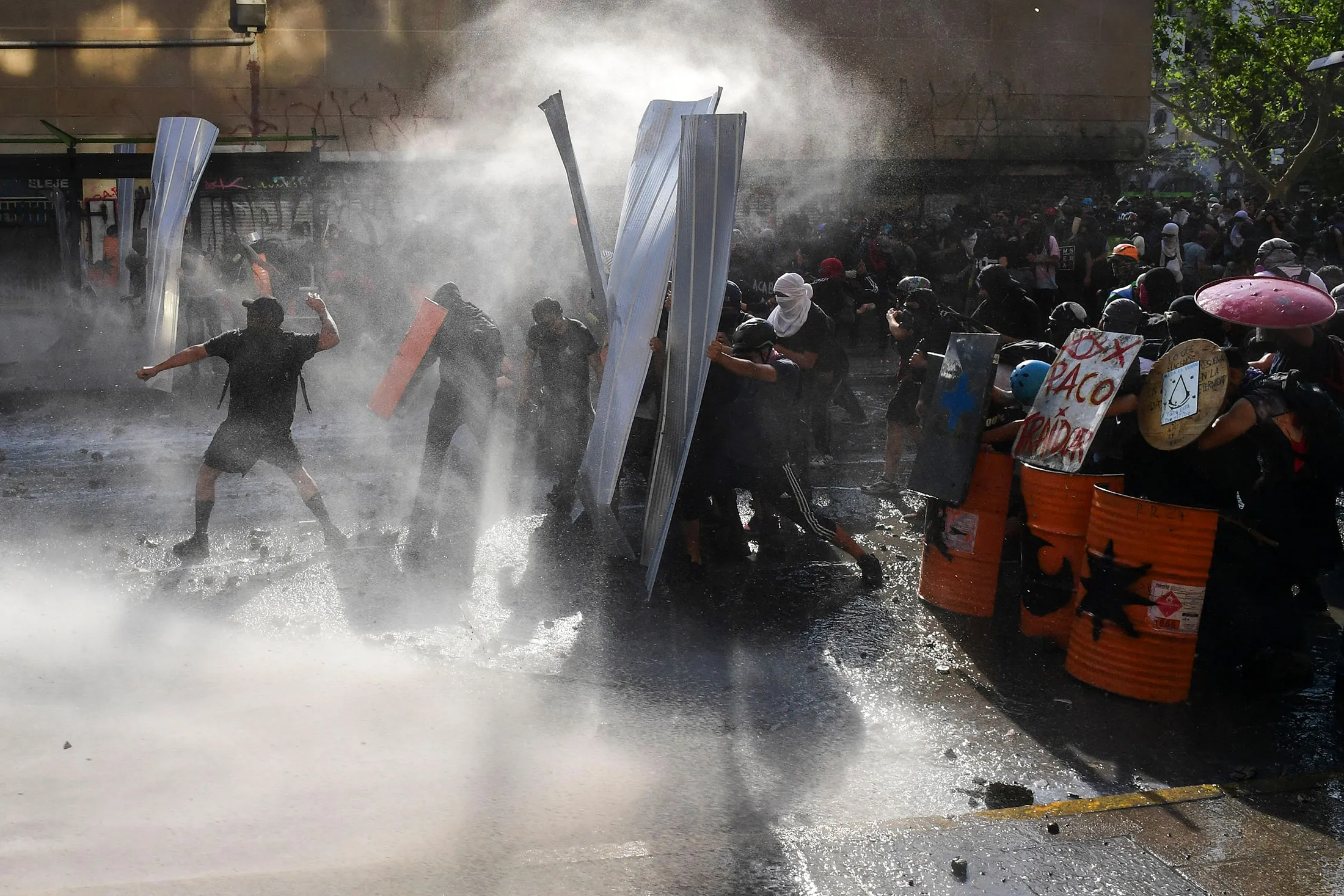 Demonstrators clash with riot police during a protest in Santiago, Chile on Nov. 14, 2019.&nbsp;