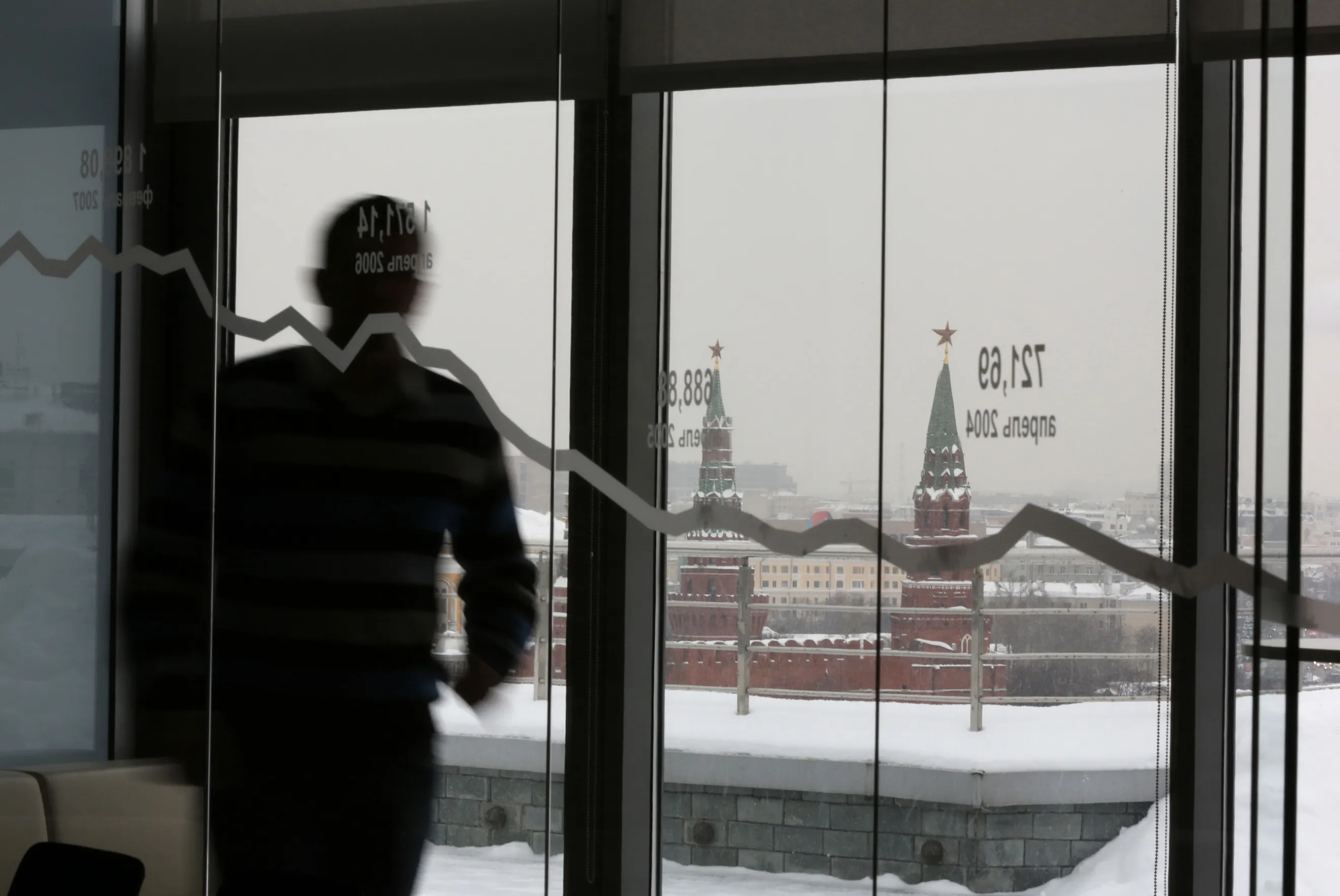 The Kremlin is seen through a window from the offices of the Moscow Exchange.