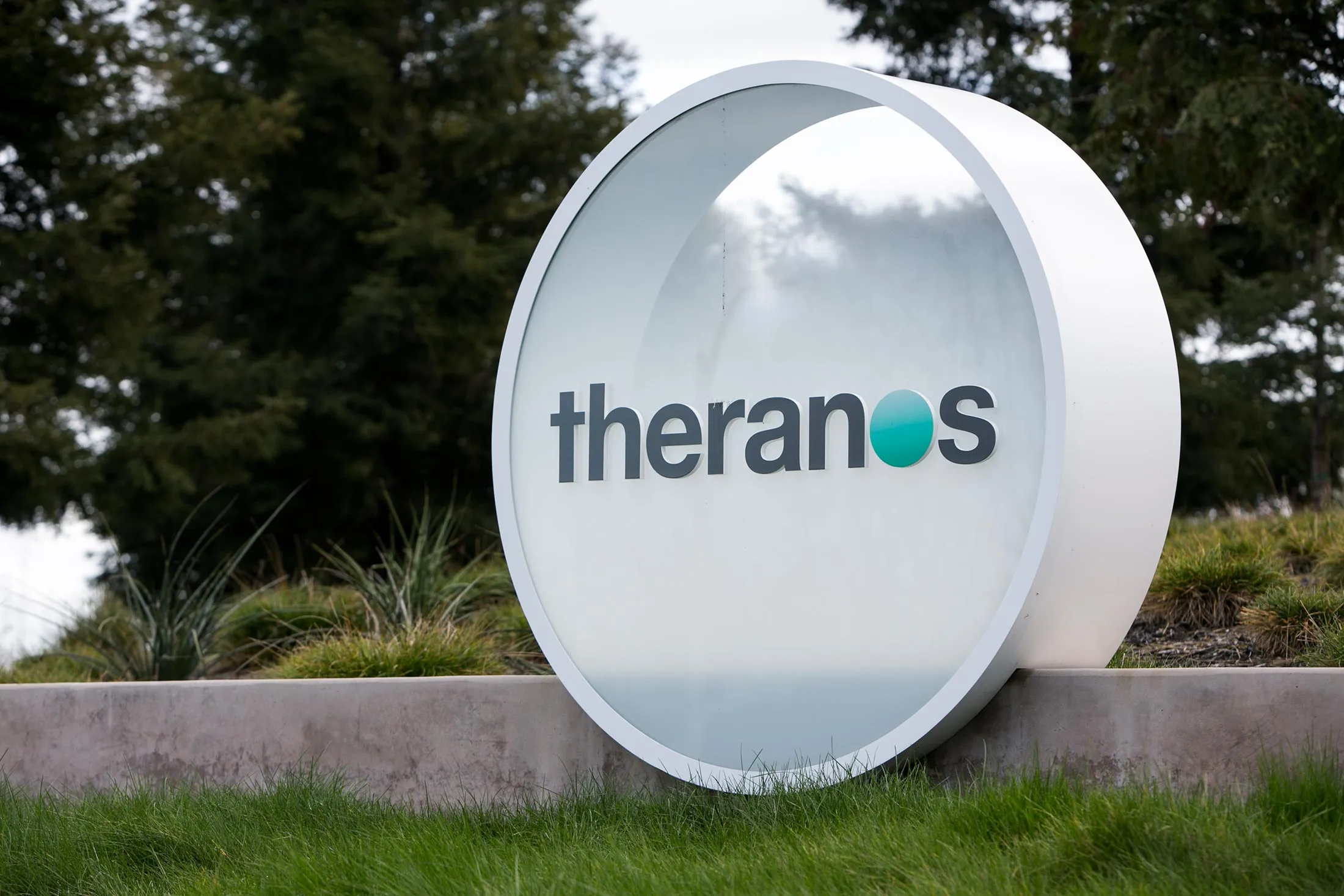 A logo sign outside of the headquarters of Theranos in Palo Alto, California on January 24, 2016.
