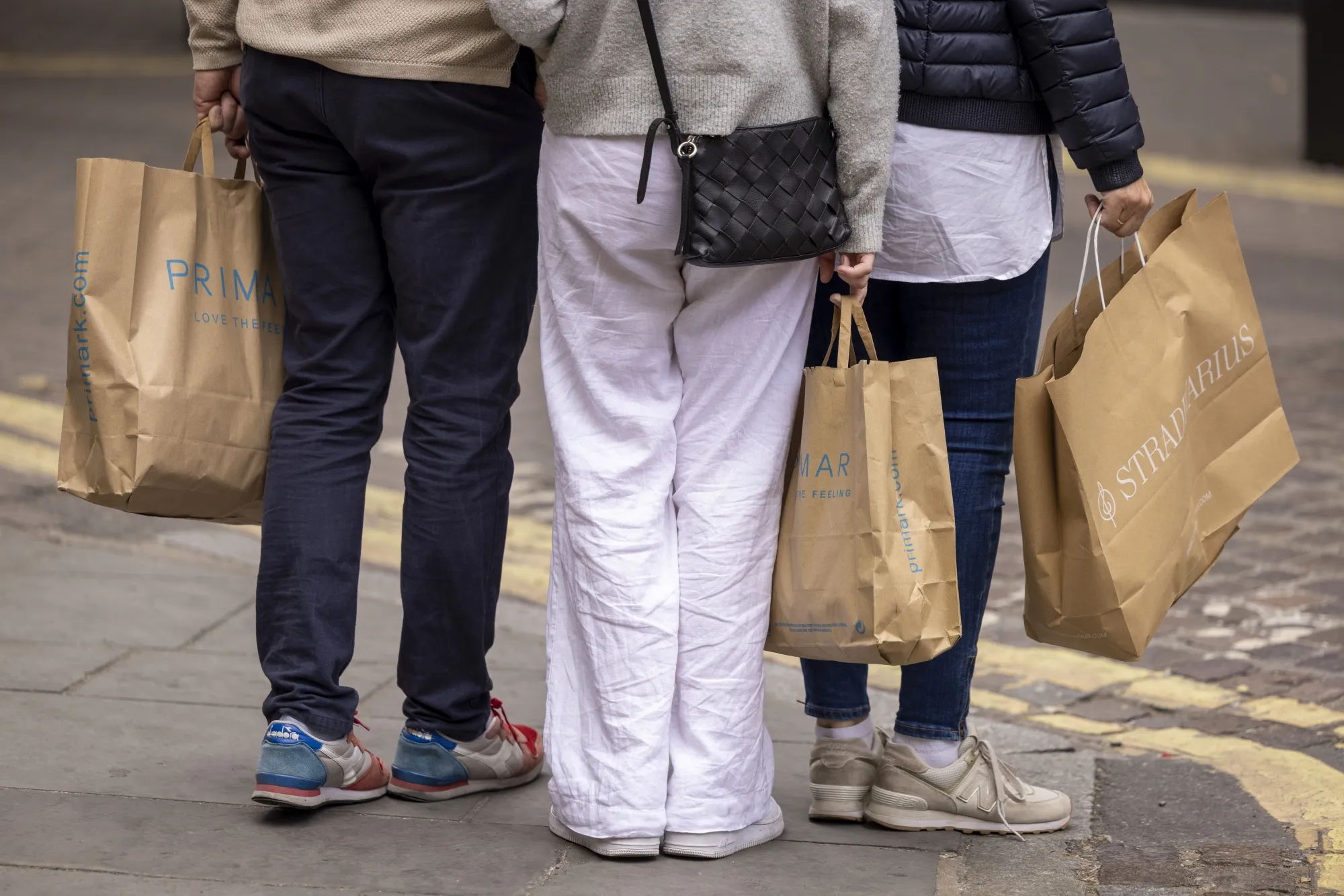 Shoppers with Primark bags in London.