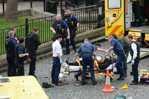 Emergency services at the scene of the attack in London, March 22.